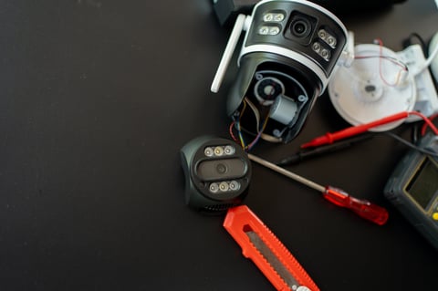 Technician upgrading or renovating security system equipment